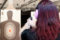 Lady Shooting Target at Indoor Range